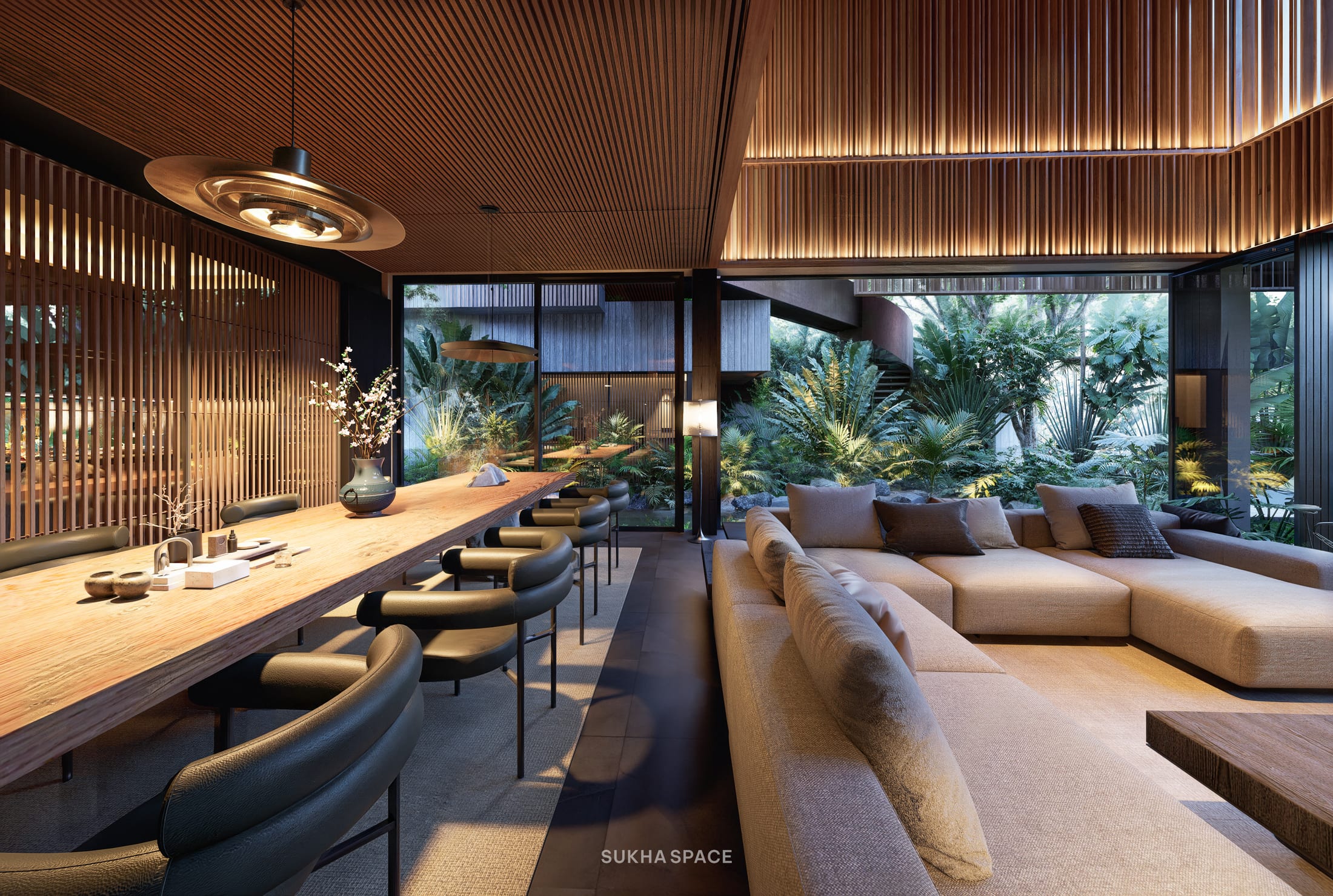 Bàn ăn dài và sofa cùng mở ra một vách kính nhìn ra vườn, Āśraya